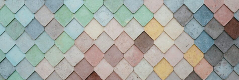 a multicolored tile wall with a pattern of small squares